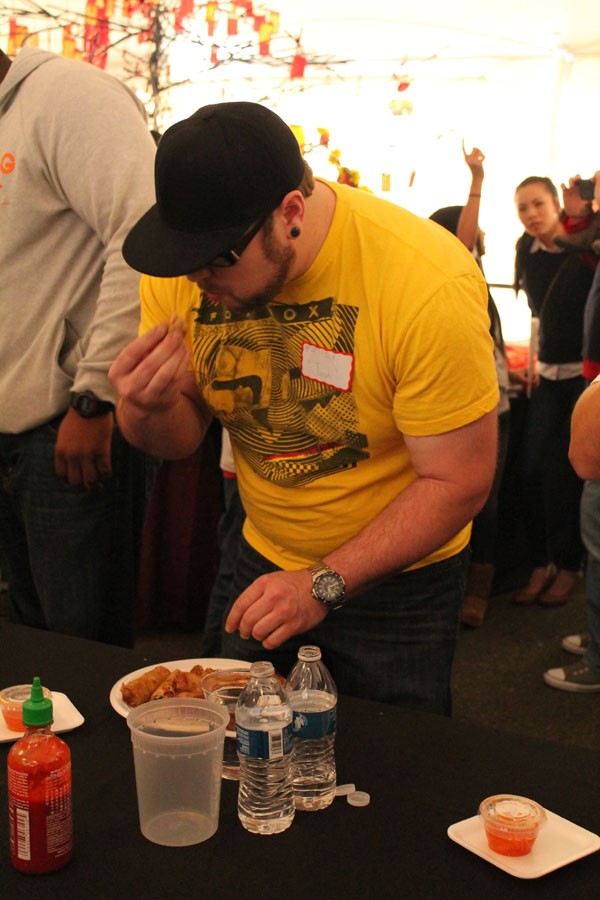 Josh Giesey struggles to keep eating during the egg roll eating contest.