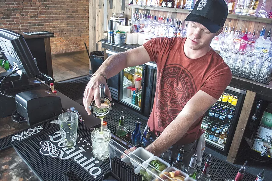 Borracho's Garrett Wellsandt pours a fire roasted margarita. - SARAH WURTZ