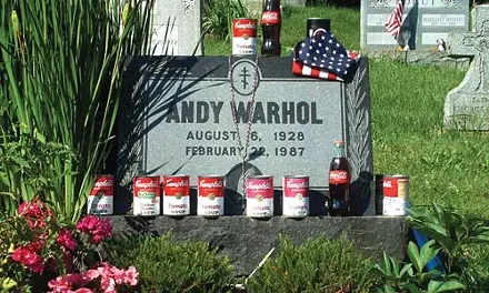 Andy Warhol's grave, adorned by visitors, in Madelyn Roehrig's "Figments: Conversations With Andy."