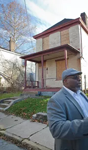 Rashad Byrdsong tours a particular section of Homewood near Westinghouse Academy that has seen especially large amounts of blight and violence over the years. - PHOTO BY HEATHER MULL