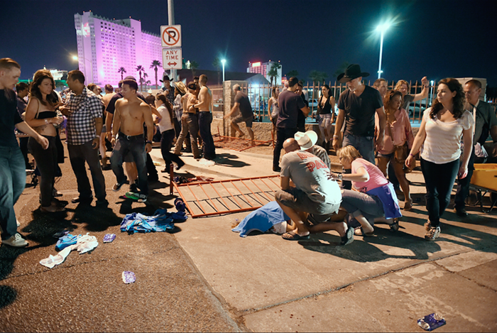 People tend to the wounded outside the Route 91 Harvest Country music festival grounds after an apparent shooting on October 1, 2017 in Las Vegas, Nevada. There are reports of an active shooter around the Mandalay Bay Resort and Casino. People tend to the wounded outside the Route 91 Harvest Country music festival grounds after an apparent shooting on October 1, 2017 in Las Vegas, Nevada. There are reports of an active shooter around the Mandalay Bay Resort and Casino.