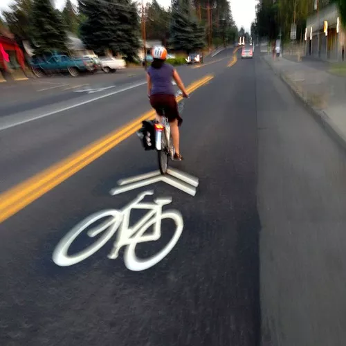 Sharrows keep riders centered in the road and clear of opened car doors.