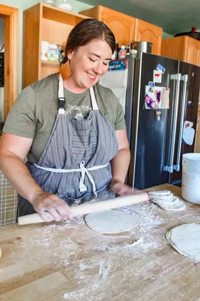 Annie Skelton rolls out pie crust dough, made with a recipe passed down from her aunt. - NANCY PATTERSON