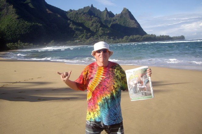 A Source Weekly, spotted on the north shore of Kaua&#39;i! Source staffer Richard Sitts, in his signature tie-dye gear, brought a copy of the Source on vacation, just to share this photo. Makes us wonder, where else has the Source gone this year? - WILL WHERITY