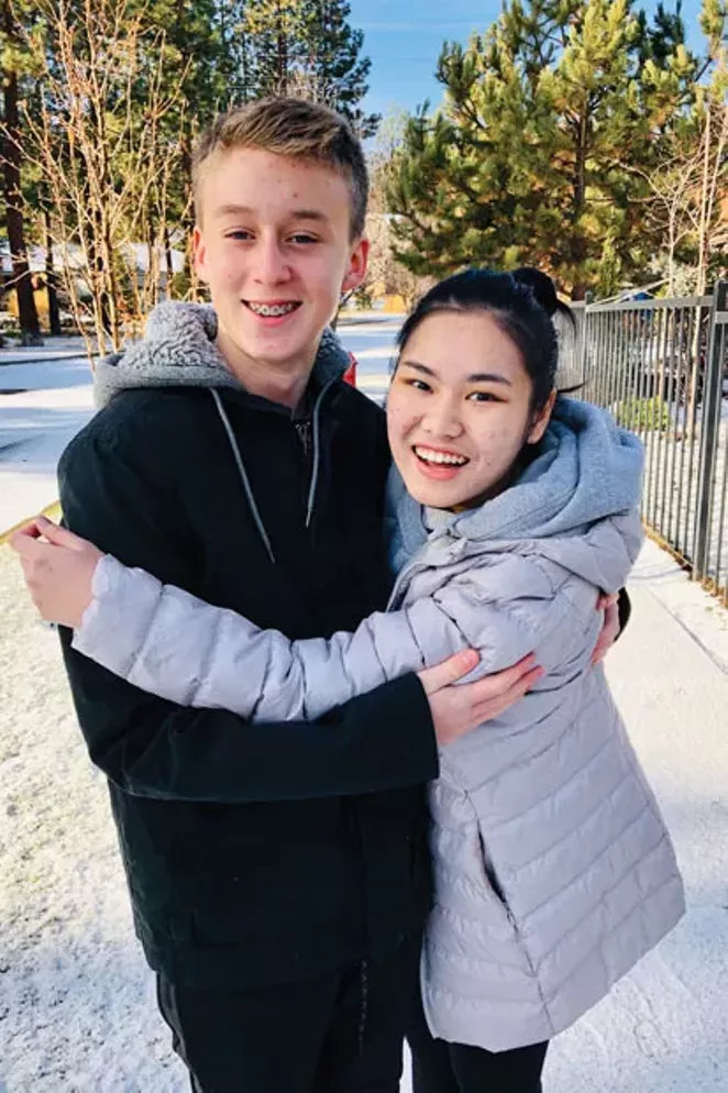 Earn shares a hug with her "brother" during her study abroad program in Bend. - COURTESY OF THE PRICE FAMILY