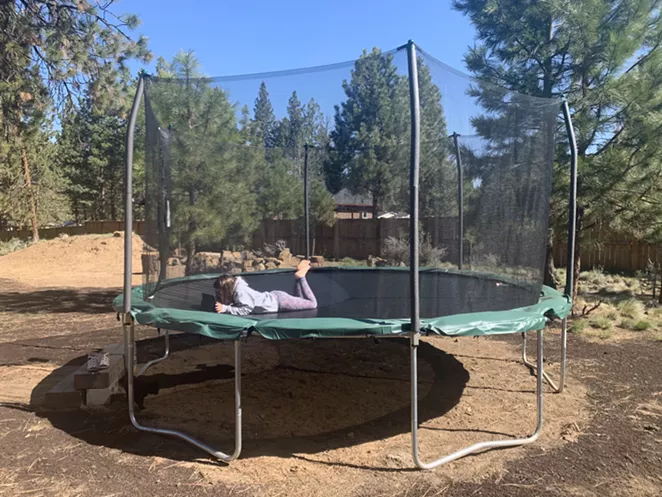 Social distanced learning on a giant, backyard trampoline. - JOSHUA SAVAGE