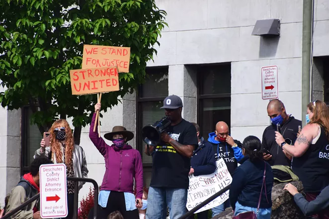 Riccardo Waites, founder of the Central Oregon Black Leaders Assembly, speaks in front of the District Attorney's office June 6. - ISAAC BIEHL