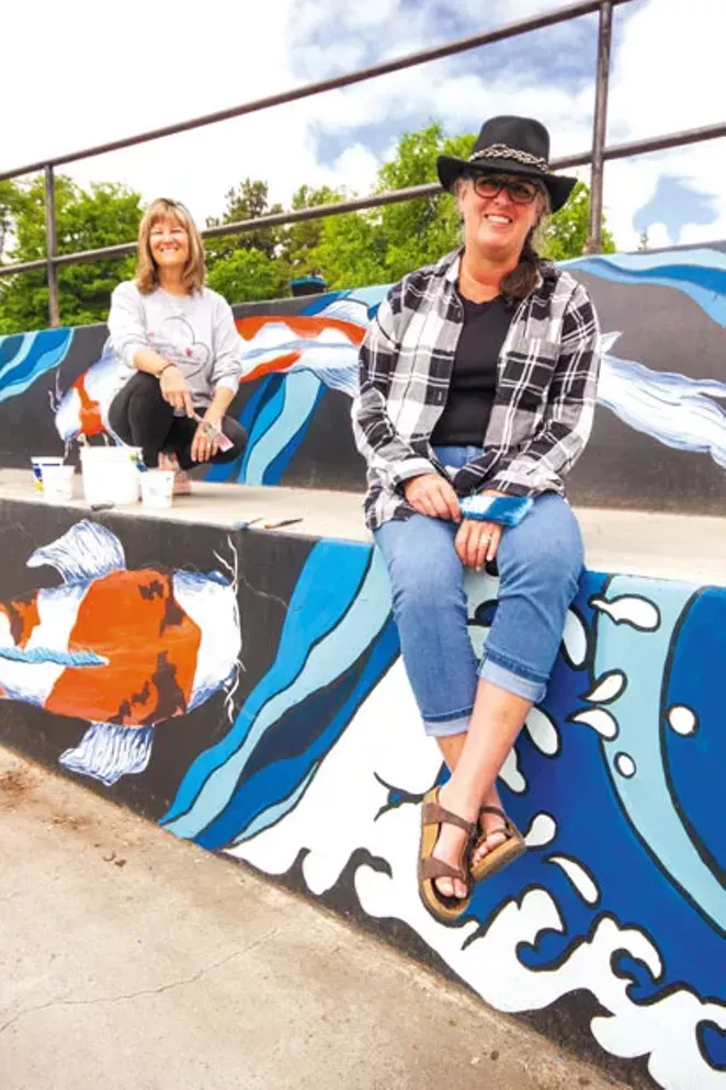 Artists Tracy Thille and Kris Cranston at the Redmond skate park mural. - DARRIS HURST