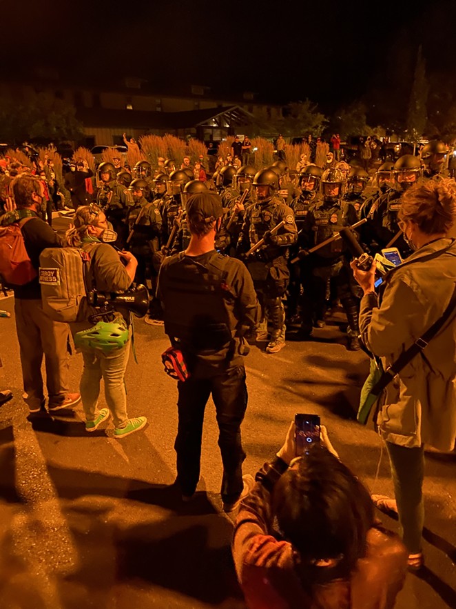 The situation got a lot more tense Wednesday when agents from U.S. Border Patrol arrived. In a press conference Thursday, Pastor Morgan Schmidt, seen in this photo with a backpack on, told the crowd that protesters felt safe until federal agents arrived. - NICOLE VULCAN