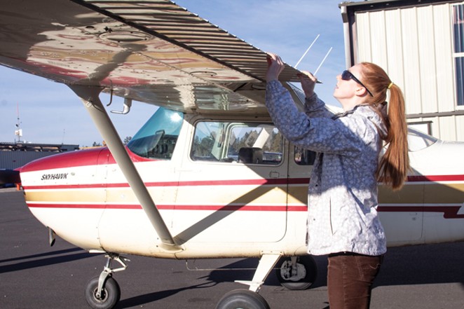 Outlaw Aviation student pilot Mary Root completing a pre-flight inspection of her Cessna 120 tailwheel light aircraft. - KYLE SWITZER