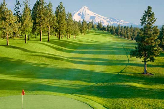 Mountains stand in the distance at River's Edge Golf Course in Bend. The course could be converted into up to 400 homes developed by Pahlisch Homes. - COURTESY VISITBEND