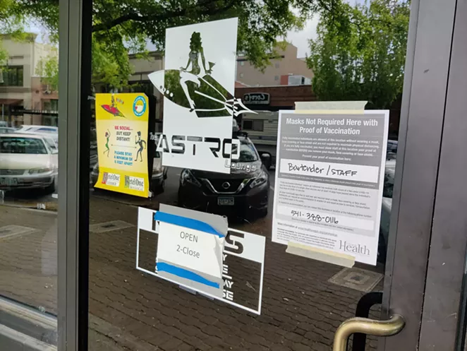 A sign at Astro Lounge in Downtown Bend informs customers that they will allow non-masked patrons after they show proof of vaccination - JACK HARVEL