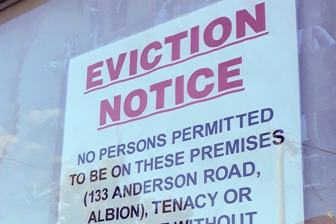 An eviction notice hangs in a window. - COURTESY OF DAVID JACKMANSON