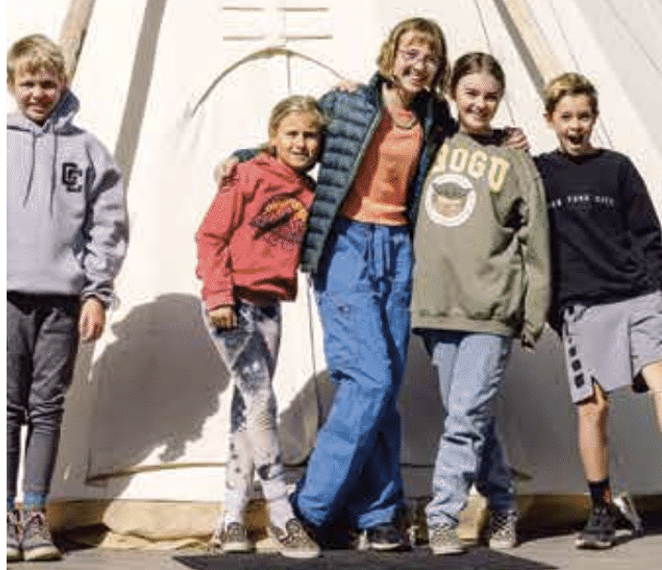 Forge students enjoy free time outside their tipi classroom. - NATALIE STEPHENSON
