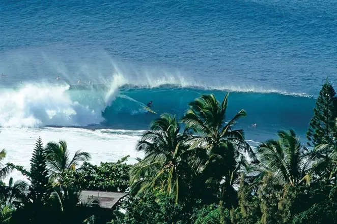 This shot from 1991 gives an interesting perspective of a tube ride at Pipeline. The wave will break in front of the surfer, but it is the Pipe so he will be able to ride through the tunnel... or so he hopes. - JEFF DIVINE
