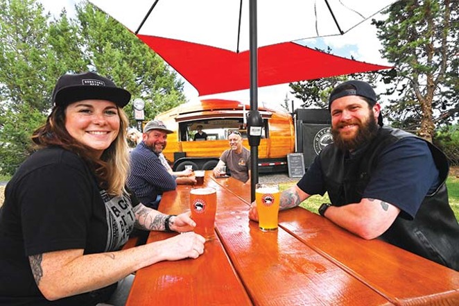 Happy visitors relax with brews at the Deschutes outdoor beer garden. - COURTESY DESCHUTES BREWERY