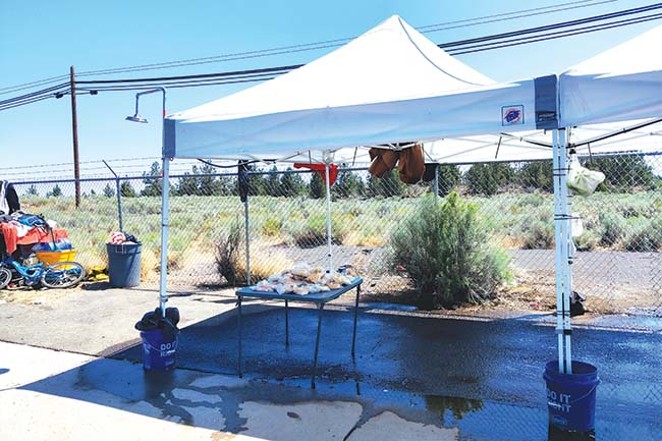 The City of Bend set up this misting tent on Hunnell Road north of town. - JACK HARVEL