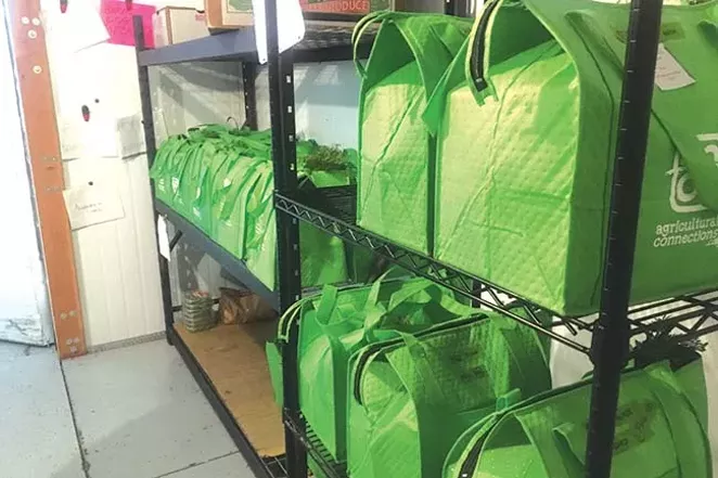 Produce bags are filled with seasonal items harvested by local farmers. - CHRIS WILLIAMS