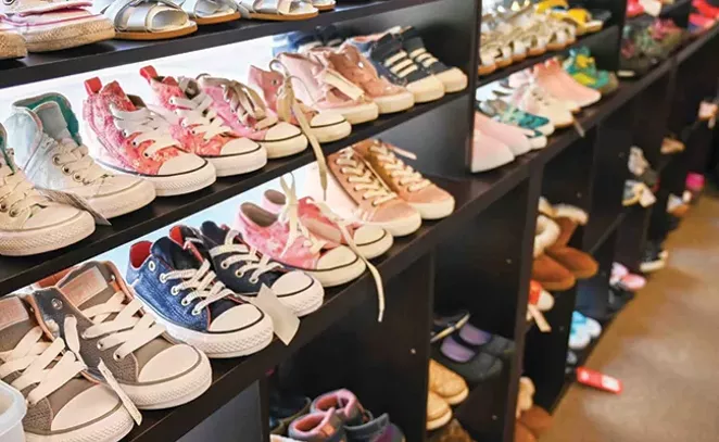 Slightly loved shoes fill the shelves at Stone Soup in Bend. - SUBMITTED