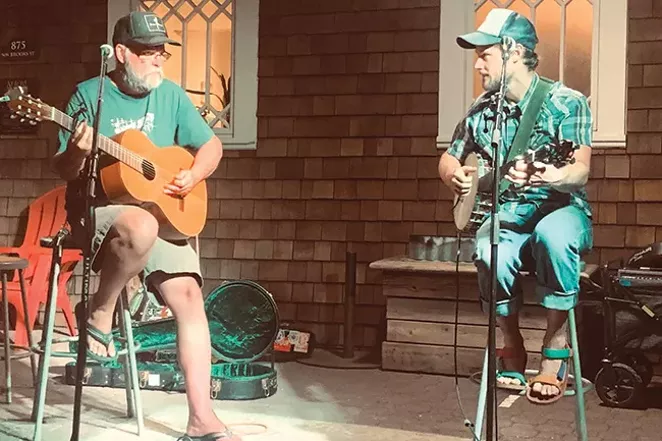 Handing over the reins. Here is Bill Powers, left, and Ky Burt during Powers' last night as host of the Storytellers Open Mic. - COURTESY OF BILL POWERS