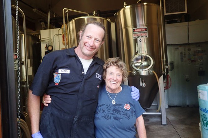 Homebrewer Nancy Noll, right, gets a congratulatory hug from fellow brewer Patio. - SUBMITTED / THREE CREEKS BREWING