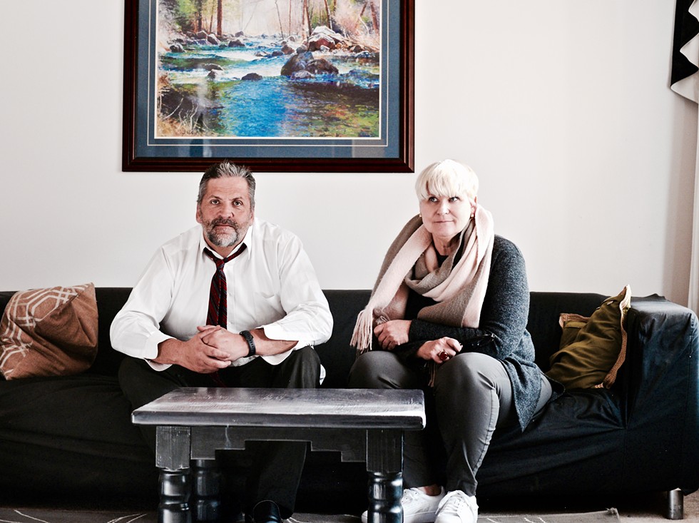 Gene Gammond and Sally Pfeifer sit in one of their transitional homes, in Bend, Oregon. They're leading the charge on re-thinking housing options for those in recovery from drug and substance abuse and those who have been recently released from jail. - MAGDALENA BOKOWA