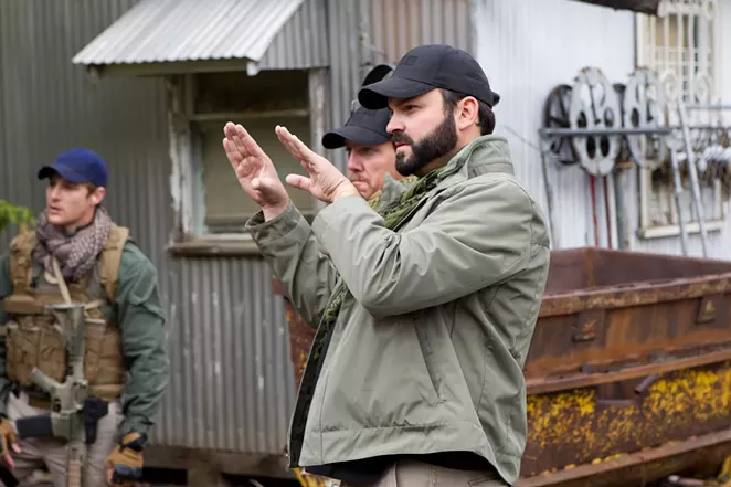 Nicolas practicing his mime moves. Or his directing. We're not sure. - IMDB
