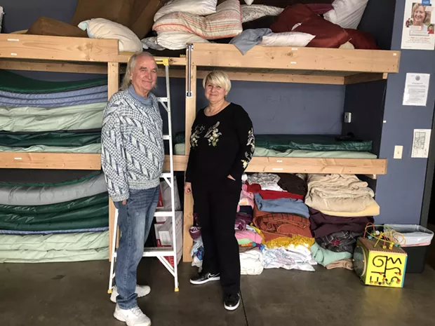 Larry Kogovsek and Sally Pfeifer stand in front of the newly-constructed bunk beds in the Sagewood Sanctuary, located inside Pfeifer & Associates on NW Greenwood Ave. - NICOLE VULCAN