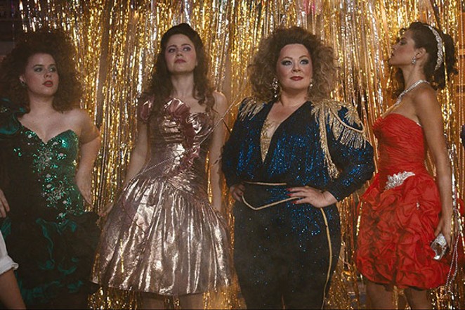Melissa McCarthy and friends showing how to rock an '80s party. - WARNER BROS