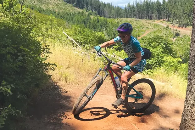 Emily Carr navigates a switchback in Post Canyon—in a cycling dress. - SEFANO SPEDINI