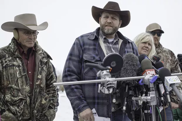 Ammon Bundy, center, speaks to reporters. - TIME.COM