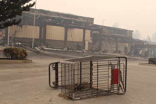 An abandoned shopping cart sits outside a Safeway store in Paradise, Calif. - MEREDITH J. COOPER, CHICO NEWS & REVIEW