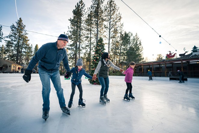 A family skates at the outdoor rink at the Seventh Mountain Resort last winter. - NATE WYETH