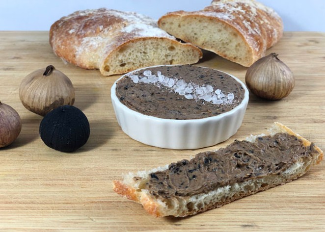 Salted butter and black garlic combine to make a tempting spread for fresh bread or added to roasted, baked or mashed potatoes. - LISA SIPE