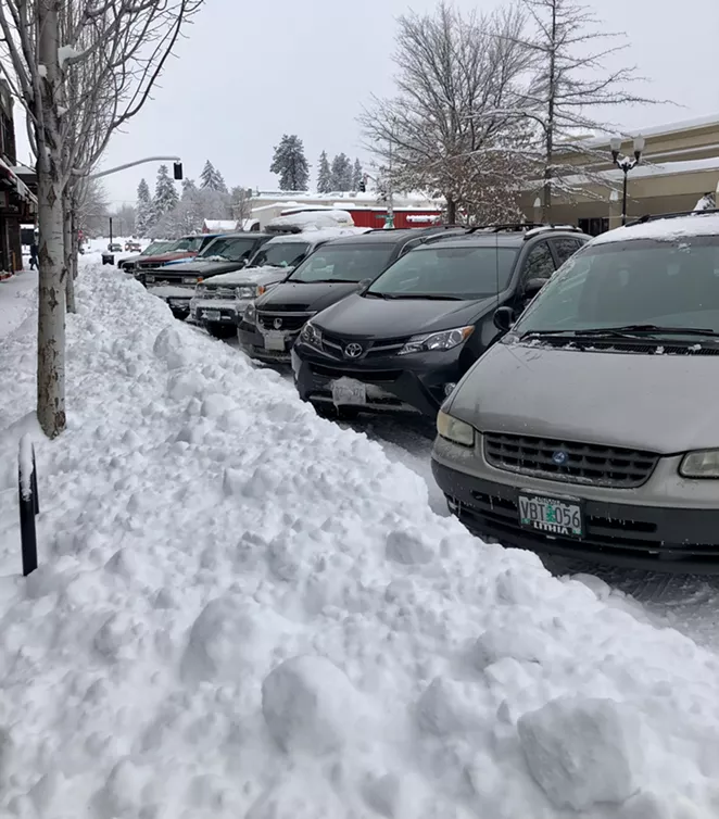 Parking spaces in downtown shrink in size when snow storms hit Bend. - CHRIS MILLER