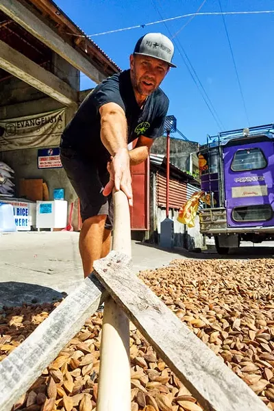 Jason Thomas works the pili nut harvest in the Philippines. - PILI HUNTERS