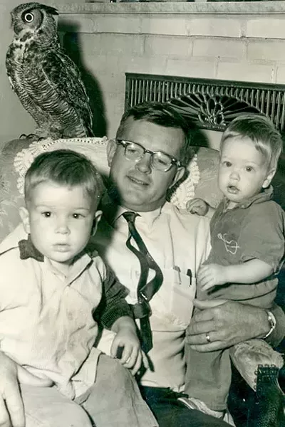 The author and his "feathered foster son," Owl, and his other sons, Dean and Ross. - HARRIET ANDERSON