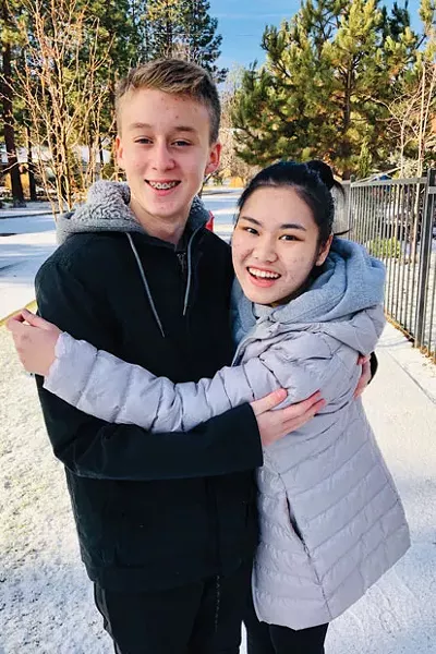 Earn shares a hug with her "brother" during her study abroad program in Bend. - COURTESY OF THE PRICE FAMILY