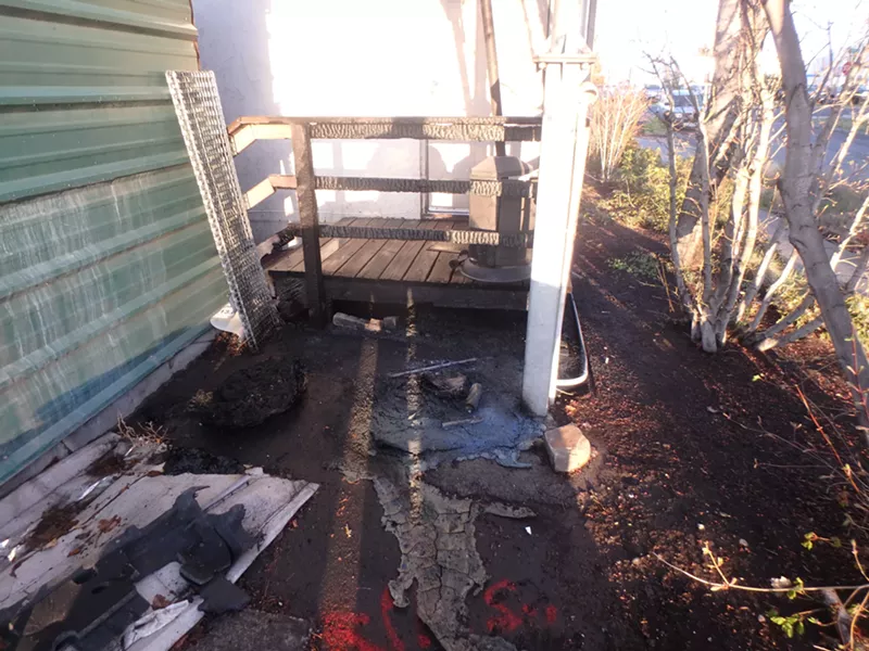 The charred remains of the deck at Enterprise Rent-A-Car, located at 315 NE Clay Ave. - BEND POLICE DEPARTMENT