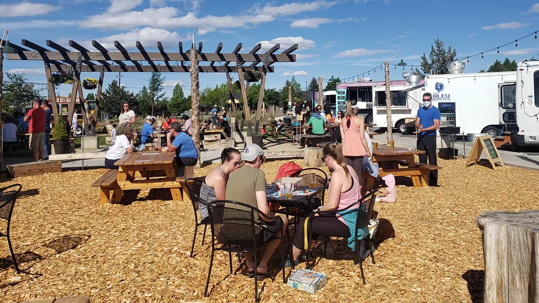 A beautiful Sunday at On Tap brought out a crowd; only one patron sported a mask while ordering. - CAYLA CLARK
