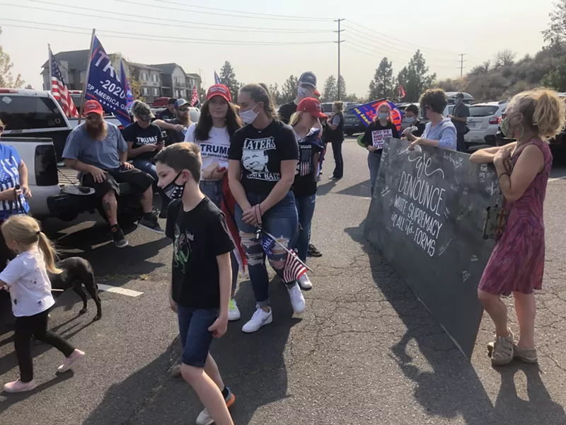 Black Lives Matter protesters mingle with pro-Trump activists on Oct. 3 at Pilot Butte Neighborhood Park before violence broke out later that afternoon. - COURTNEY CHRISTENSON