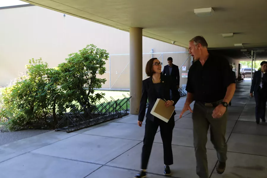 Gov. Kate Brown walks with Interior Secretary Ryan Zinke during a meeting discussing the Cascade-Siskiyou National Monument. - KATE BROWN/FLICKR