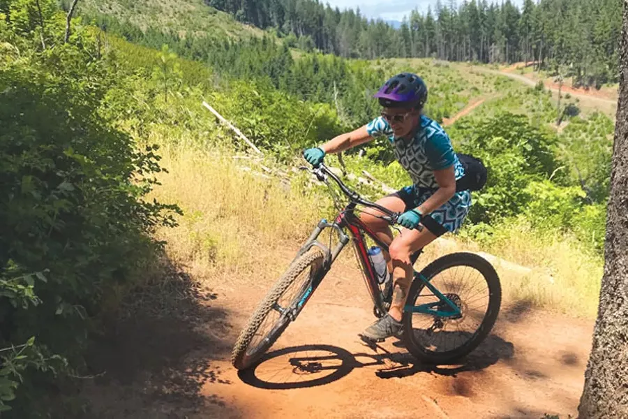 Emily Carr navigates a switchback in Post Canyon—in a cycling dress. - SEFANO SPEDINI