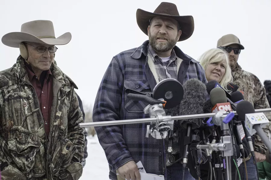 Ammon Bundy, center, speaks to reporters. - TIME.COM