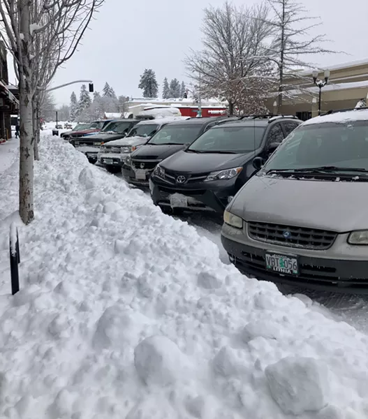 Parking spaces in downtown shrink in size when snow storms hit Bend. - CHRIS MILLER