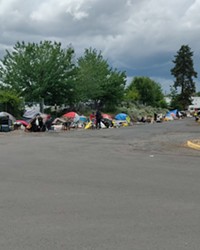 Camps line both sides of Emerson Avenue in Bend. On Wednesday, June 2, Bend City Council adopted policies that set criteria for camp removals in public right of ways.