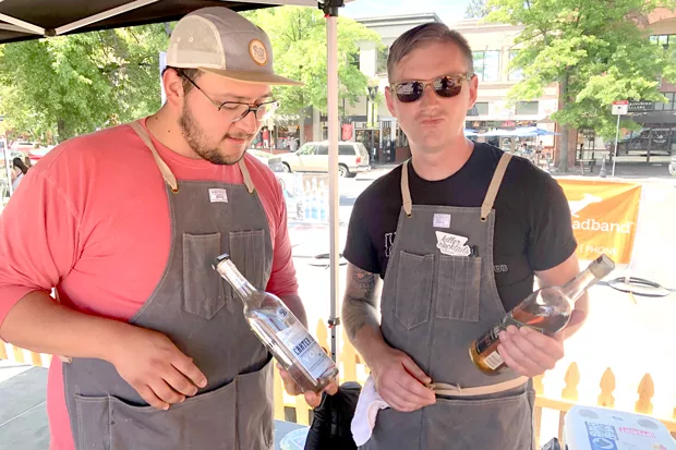 Winning bartender Brendon Harry, at right, goofs off with fellow Riff bartender, Dustin Gomez, at the Bartenders' Brawl June 15. - NICOLE VULCAN