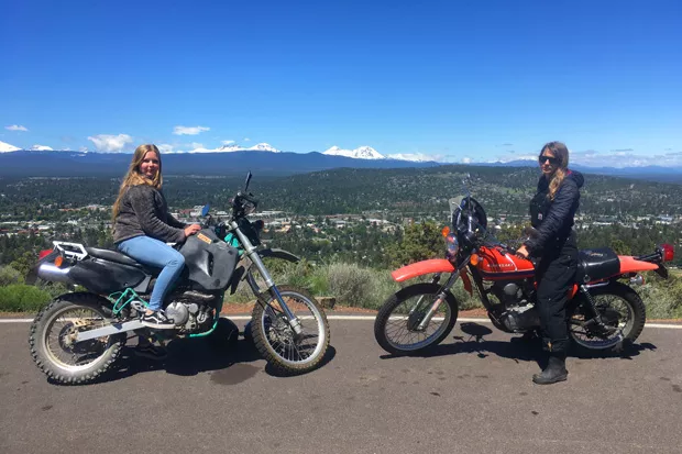 Alyssa Shavlofsky atop the Big Bad Wolf and author K.M. Collins atop Little Red Riding Hood at Pilot Butte's summit. - K.M .COLLINS