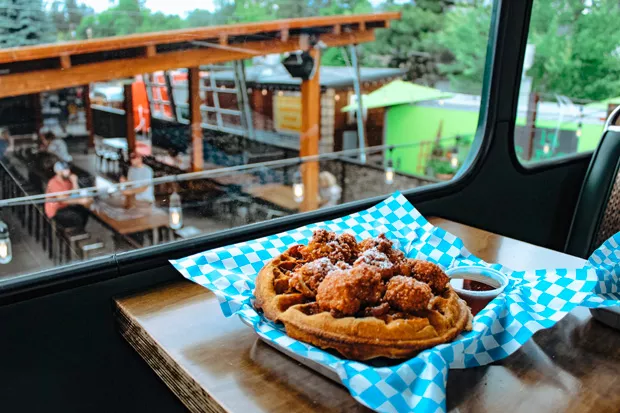 Made-to-order Belgian waffles are topped with fried chicken bites and served with powdered sugar and real maple syrup. - NANCY PATTERSON