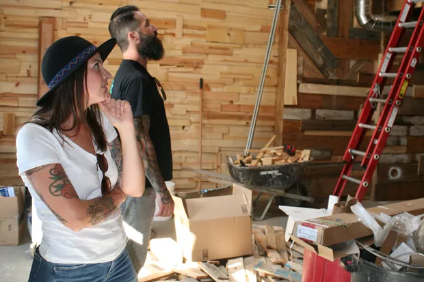 Owners Heather and Lisandro Ramon stand in the expanded portion of The Brown Owl, set to open in the next several weeks. - NICOLE VULCAN